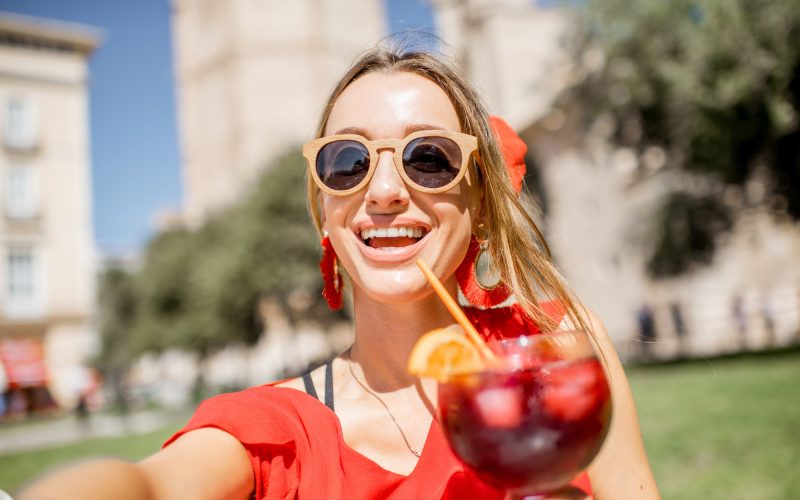 Woman with sangria drink outdoors in Valencia